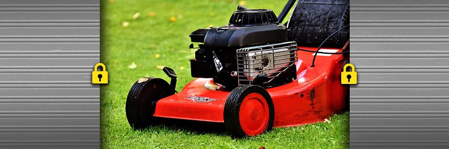 Image of red and black lawnmower with locks on either side, indicating storage service.