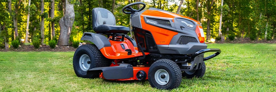 Image of tractor sitting empty on a freshly mowed lawn.